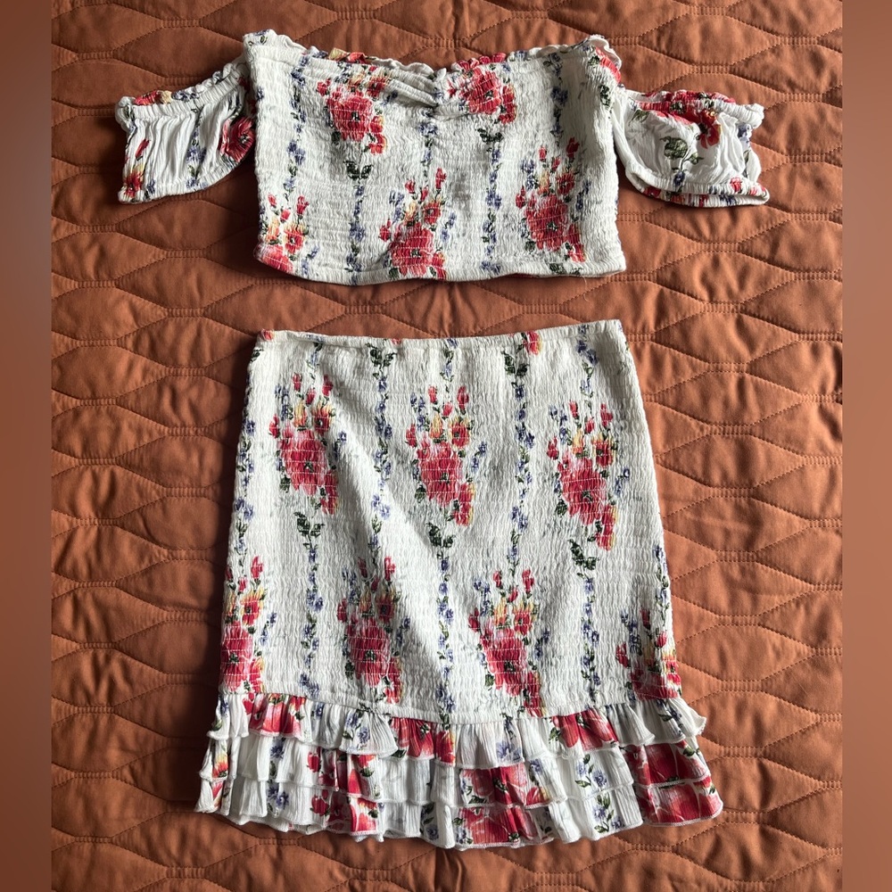 Floral 2 piece skirt and crop top outfit.